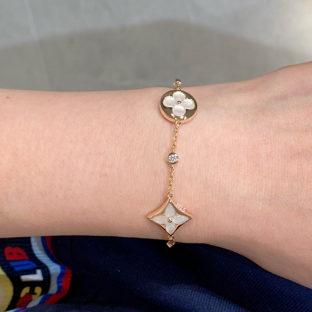 [Riva Jewelry ]STAR AND SUN 4 MOTIF WHITE MOP PINK GOLD BRACELET