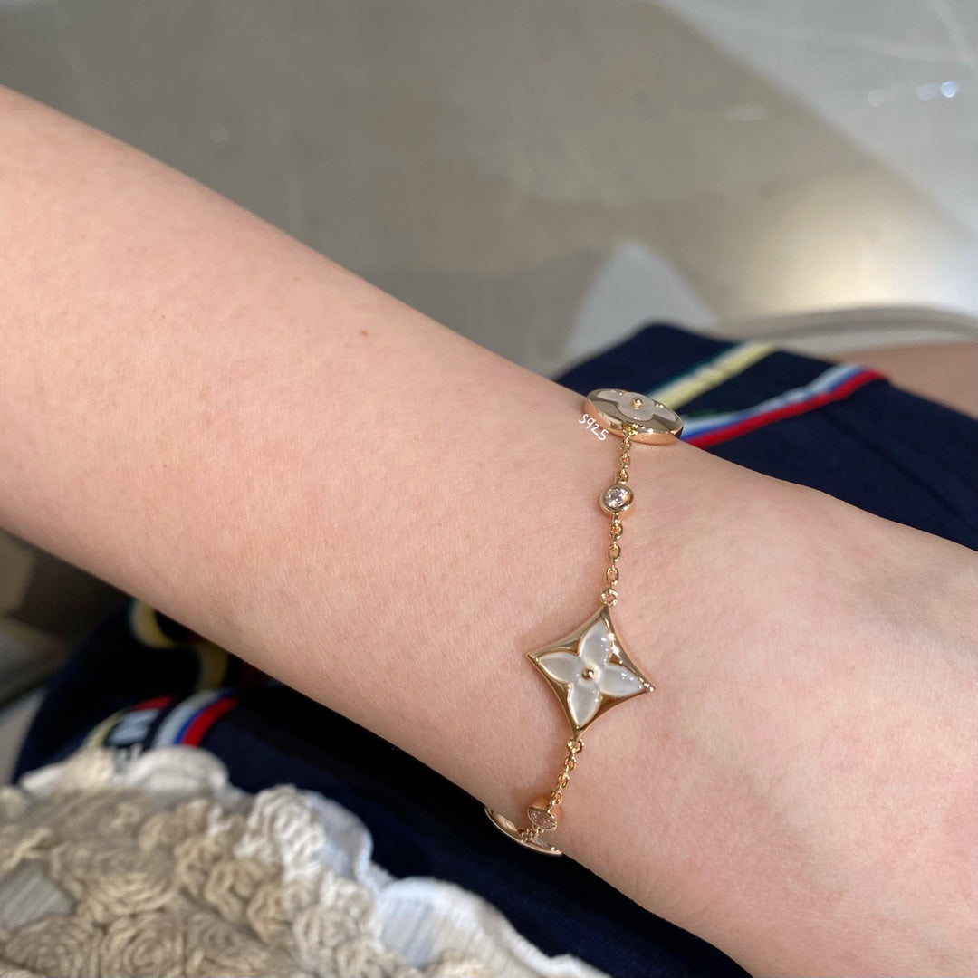 [Riva Jewelry ]STAR AND SUN 4 MOTIF WHITE MOP PINK GOLD BRACELET