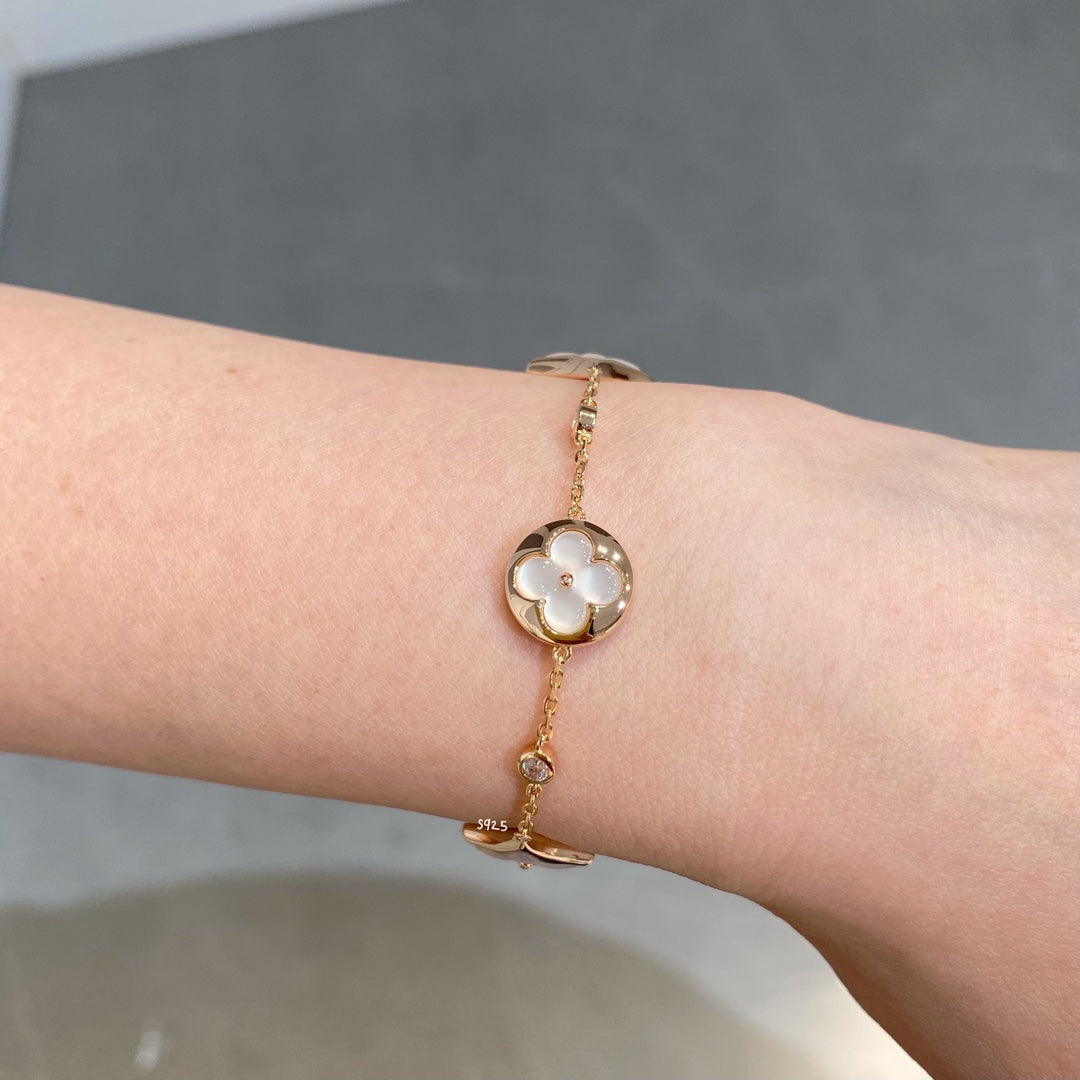[Riva Jewelry ]STAR AND SUN 4 MOTIF WHITE MOP PINK GOLD BRACELET