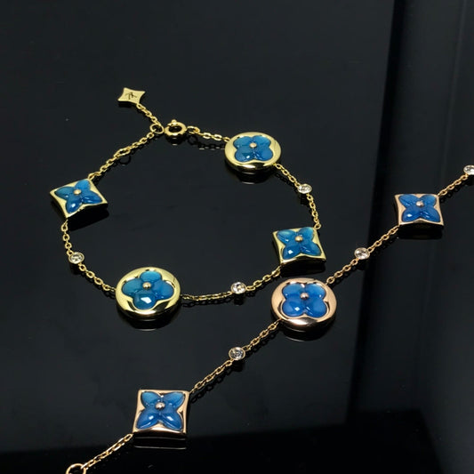 [Riva Jewelry]ARMBAND MIT STERN UND SONNE UND 4 MOTIVEN IN BLAU